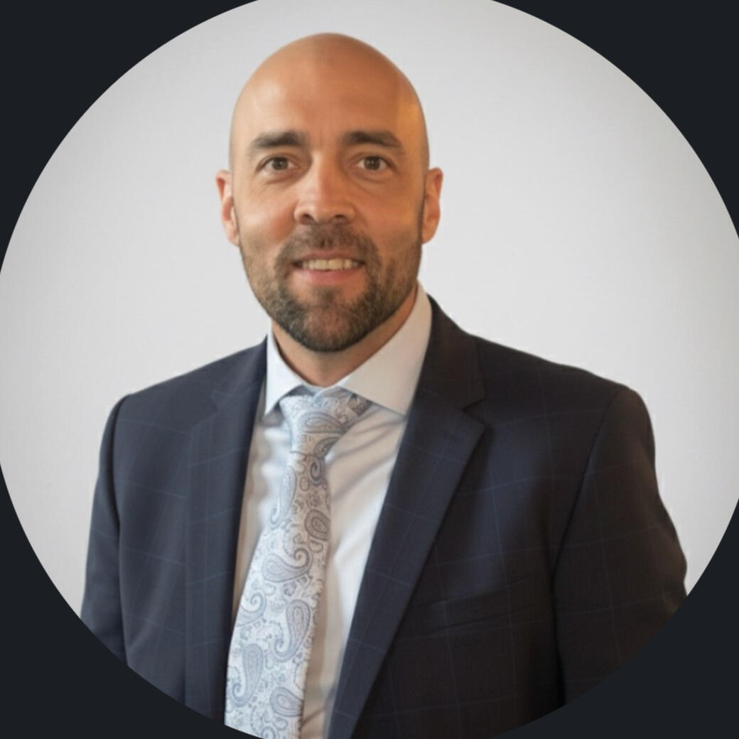 Professional portrait of the author, a transportation compliance specialist, former Ontario Ministry of Transportation officer, and fleet insurance risk consultant.